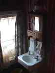 sink and cupboards in old fashioned motel room